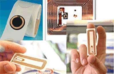Hands holding RFID tags and inlays that are attached to items for tracking