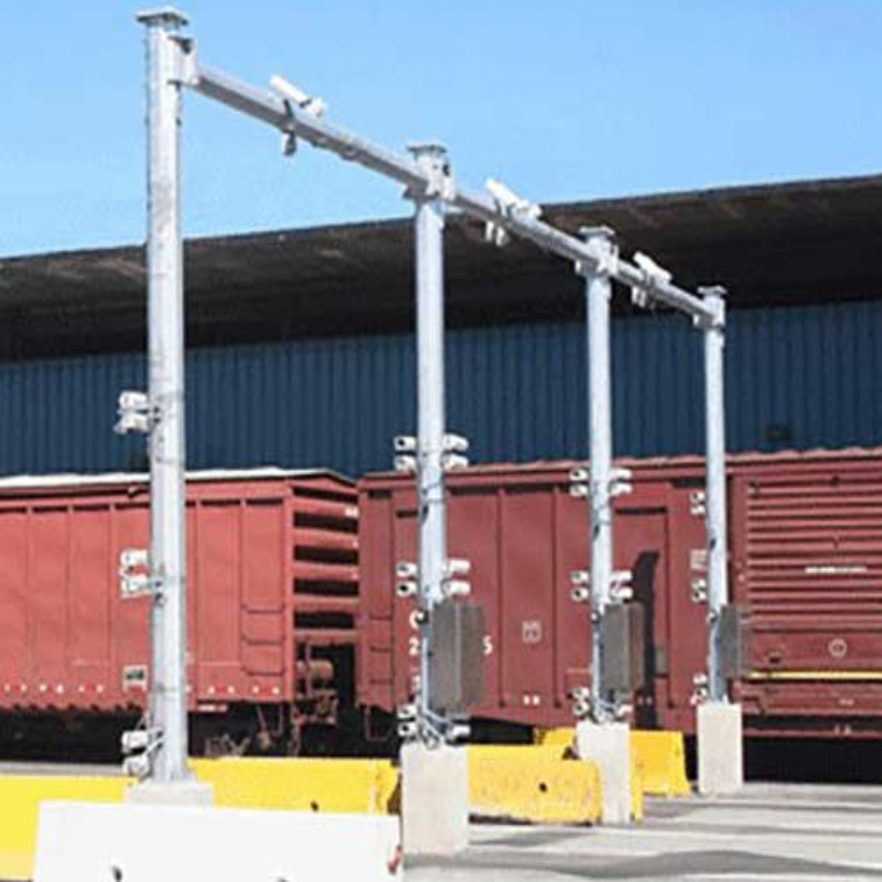Rail OCR gantry fitted with cameras above a line of freight wagons