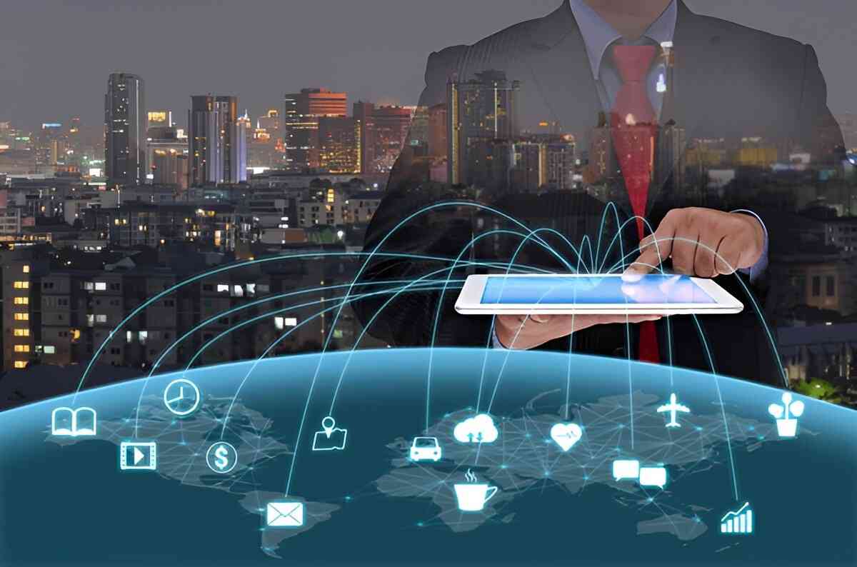 Business person tapping a tablet with glowing network lines linking icons over a city and the globe