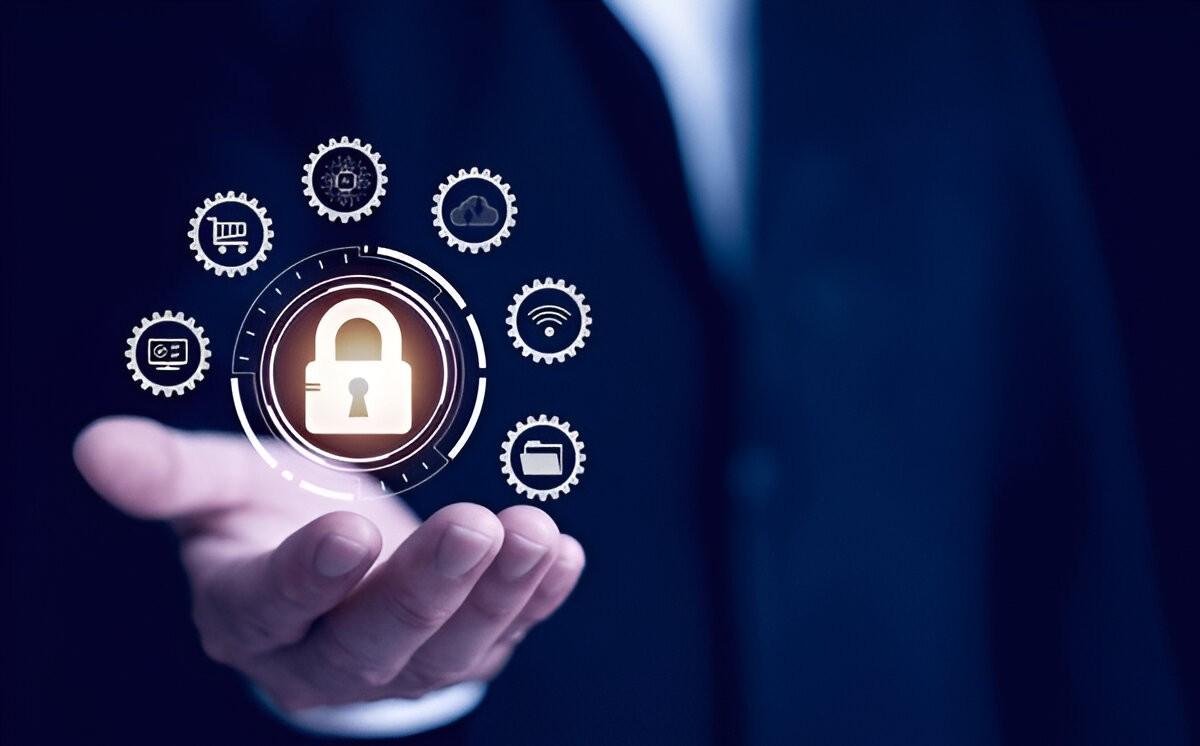 Hand holding a glowing padlock surrounded by small gear and device icons