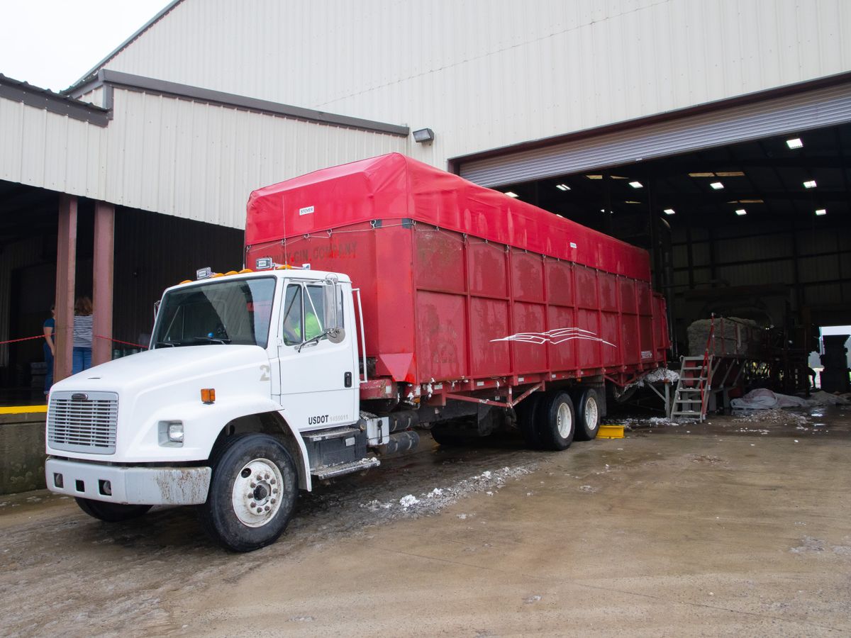 Trailer truck backed up to a warehouse loading dock